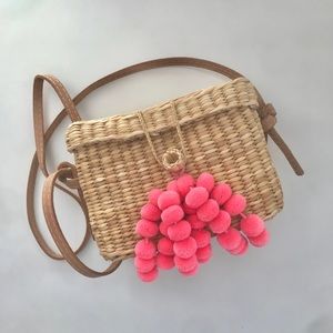 Nannacay small wicker rattan pom pom bag